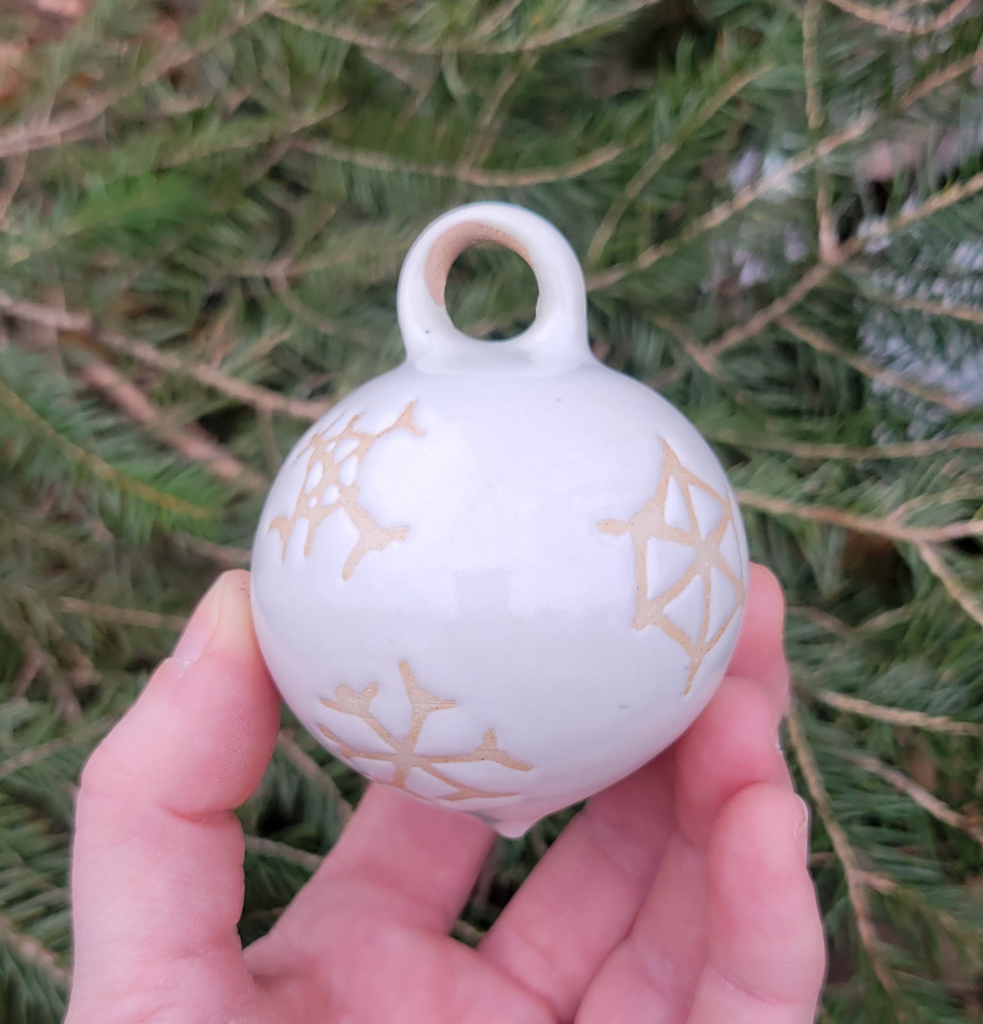 Ornament in Glossy White Snowflake Pattern